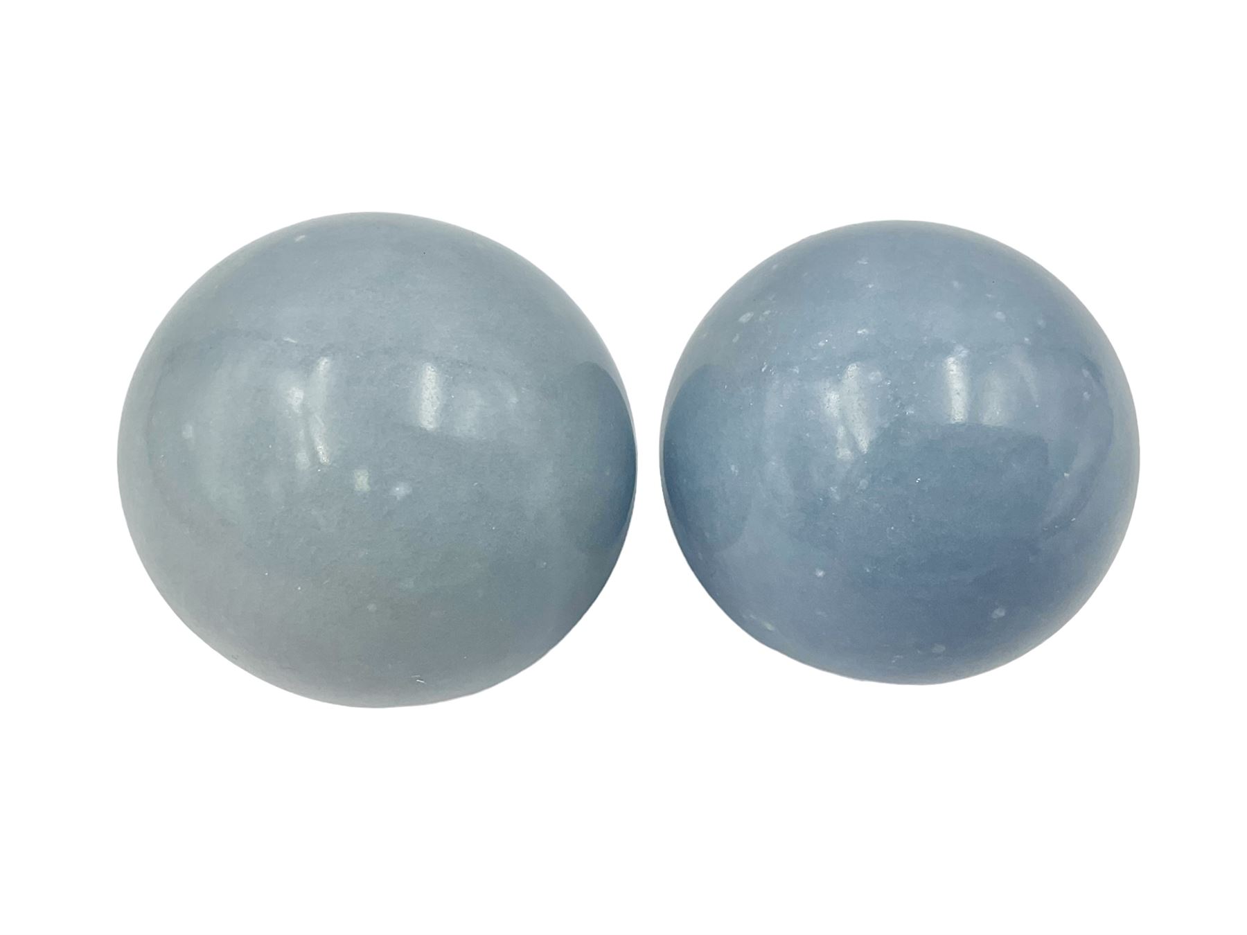 Pair of angelite spheres upon gilt metal stands, H8cm D6cm