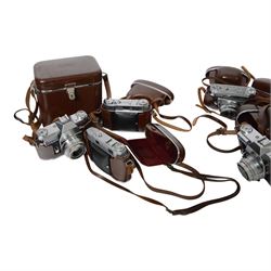 Collection of Kodak Retina cameras, including Retina Automatic I and Retina Reflex examples, together with spare cases and instruction manuals