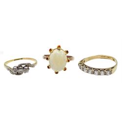 Gold three stone diamond ring, with diamond set shoulders, stamped 18c t& Pt, gold seven stone cubic zircoinia ring and a rose gold opal ring, both hallmarked 9ct