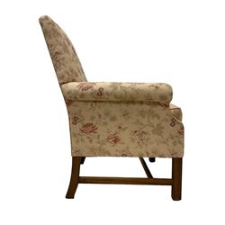 Peter Dudgeon - Georgian design mahogany framed armchair, shaped cresting rail over sprung back and seat flanked by rolled arms, upholstered in floral patterned fabric with matching seat cushion, on square supports joined by stretchers
Provenance: From the Estate of the late Dowager Lady St Oswald