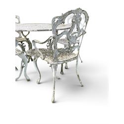 Victorian style cast aluminium white painted garden table and four armchairs chairs with S-scroll acanthus leaf pierced backs over lattice seats