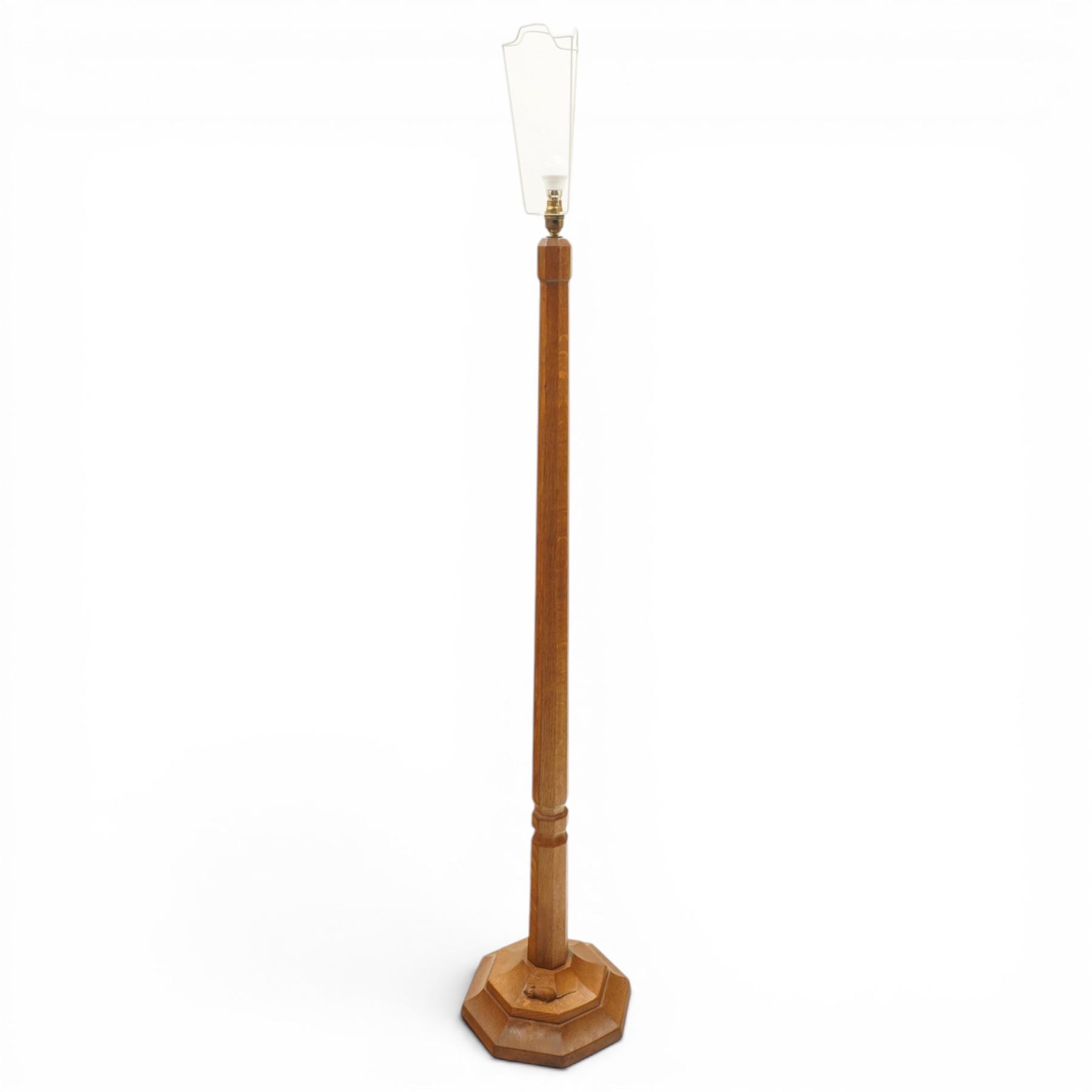 Mouseman - oak standard lamp, the turned octagonal column terminating to a stepped cavetto octagonal base, with carved mouse signature, by the workshop of Robert Thompson of Kilburn

