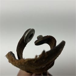 First Pattern Fairburn Sykes ''F-S'' Fighting Knife by Wilkinson Sword Ltd., the 17cm double edge steel blade with raised medial ridge to each side, each side of the ricasso with a recessed panel, one side with maker's name, the opposing side etched THE F~S FIGHTING KNIFE, with nickel plated brass recurving crossguard and diamond cut grip; in leather scabbard with metal chape