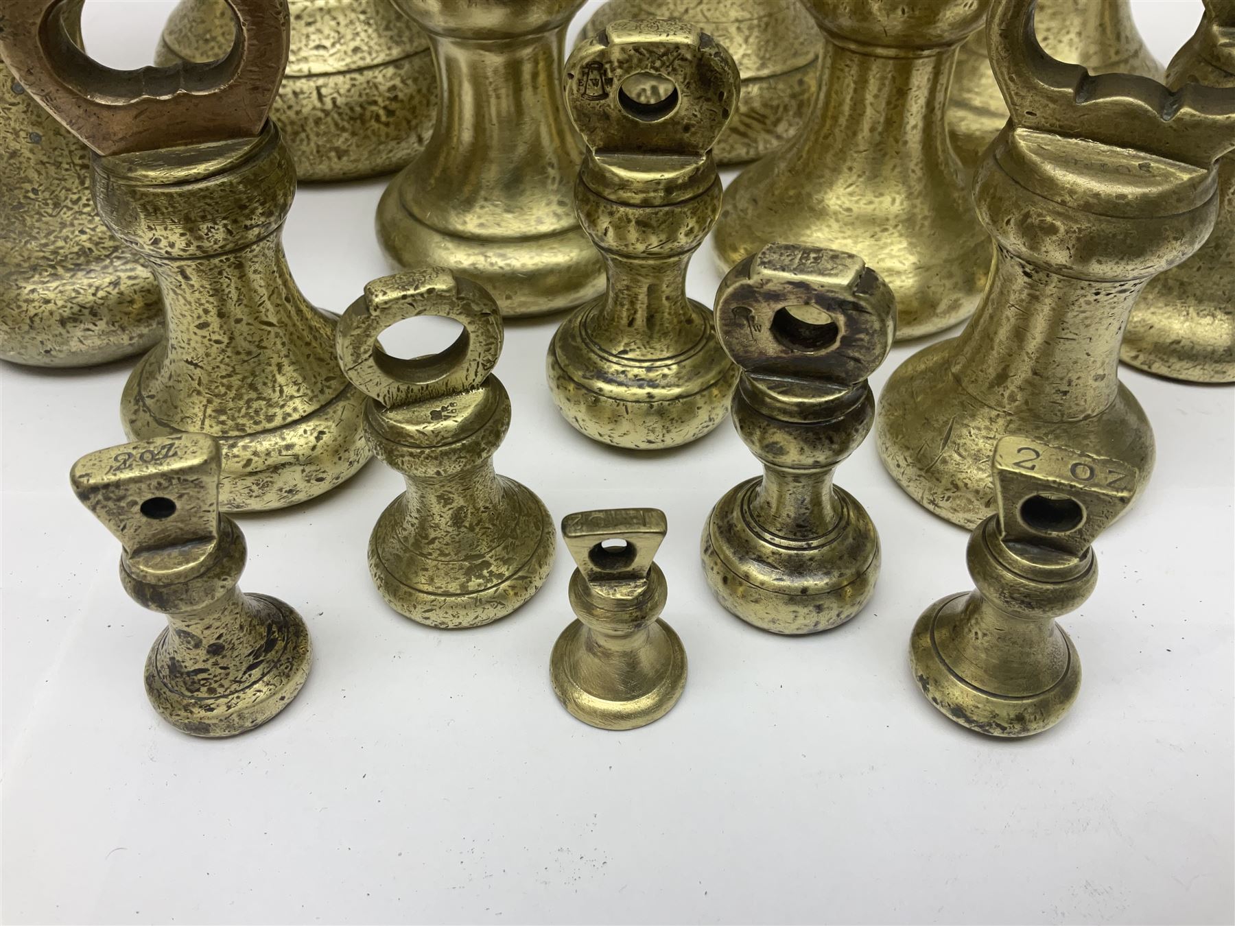 Set of seventeen Victorian brass bell weights