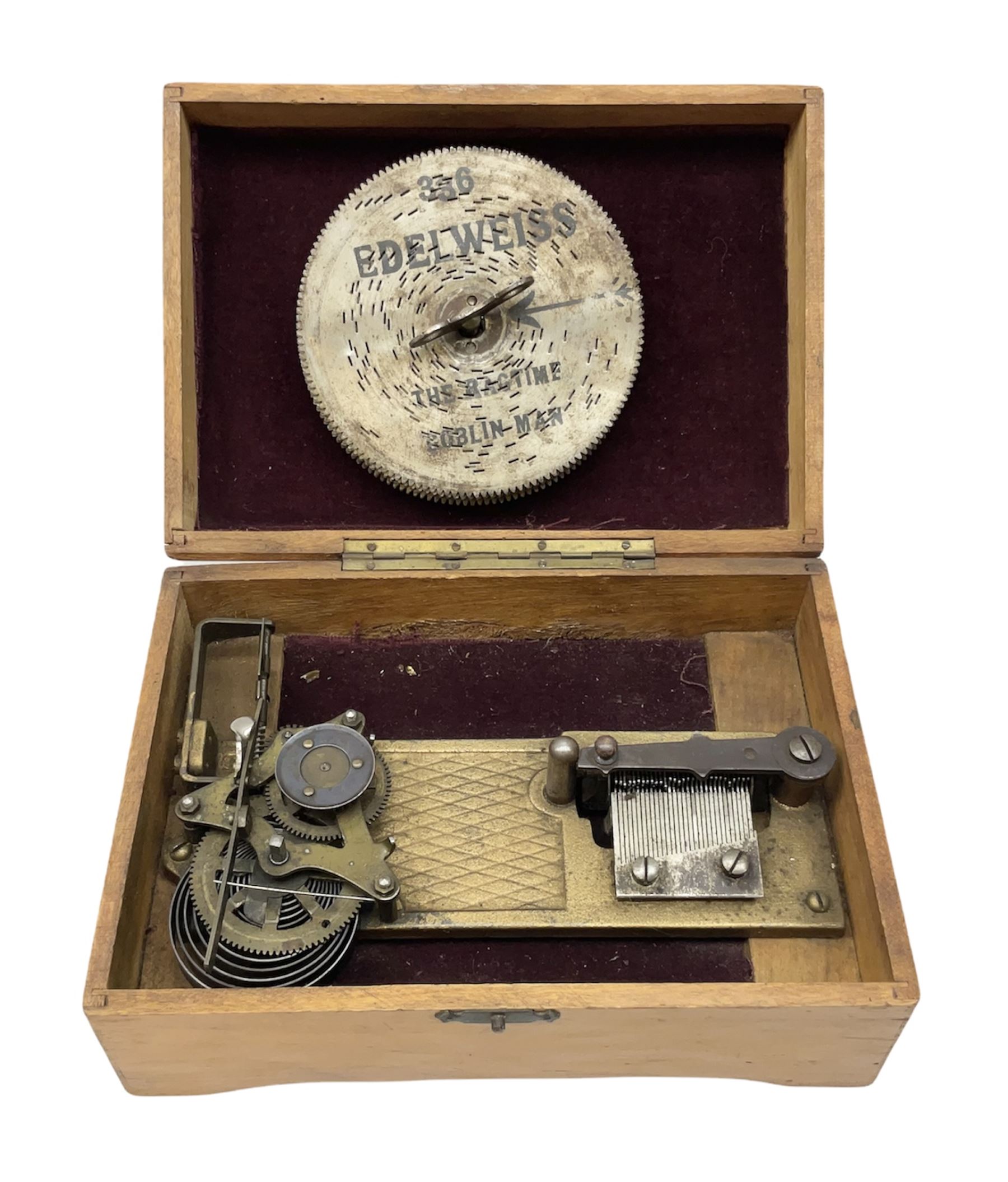 Victorian rectangular disc music box, the hinged lid with printed decoration of a young girl lifting to reveal a brass plate with single comb movement, with six discs, housed in pine case