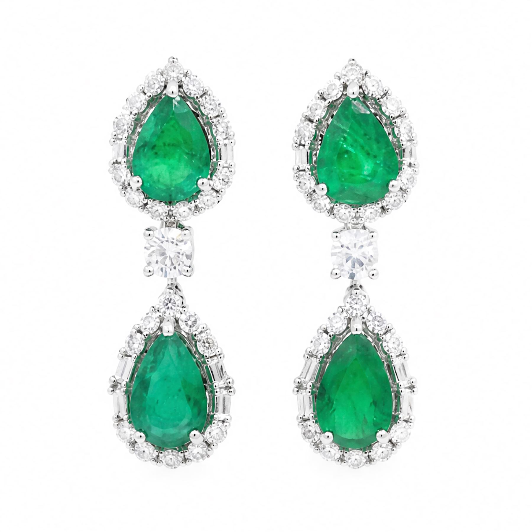 Pair of 18ct white gold emerald and diamond earrings, each stud set with two pear cut emeralds, surrounded by round brilliant cut and baguette cut diamonds, spaced by a single diamond, stamped, total emerald weight approx 4.15 carat, total diamond weight approx 1.50 carat