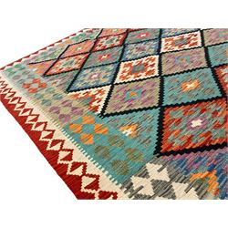 Anatolian Turkish Kilim multi-colour rug, decorated with all over lozenges in contrasting colours with dark indigo outline, the multi-band ivory and red border with repeating geometric shapes and small lozenges or diamonds