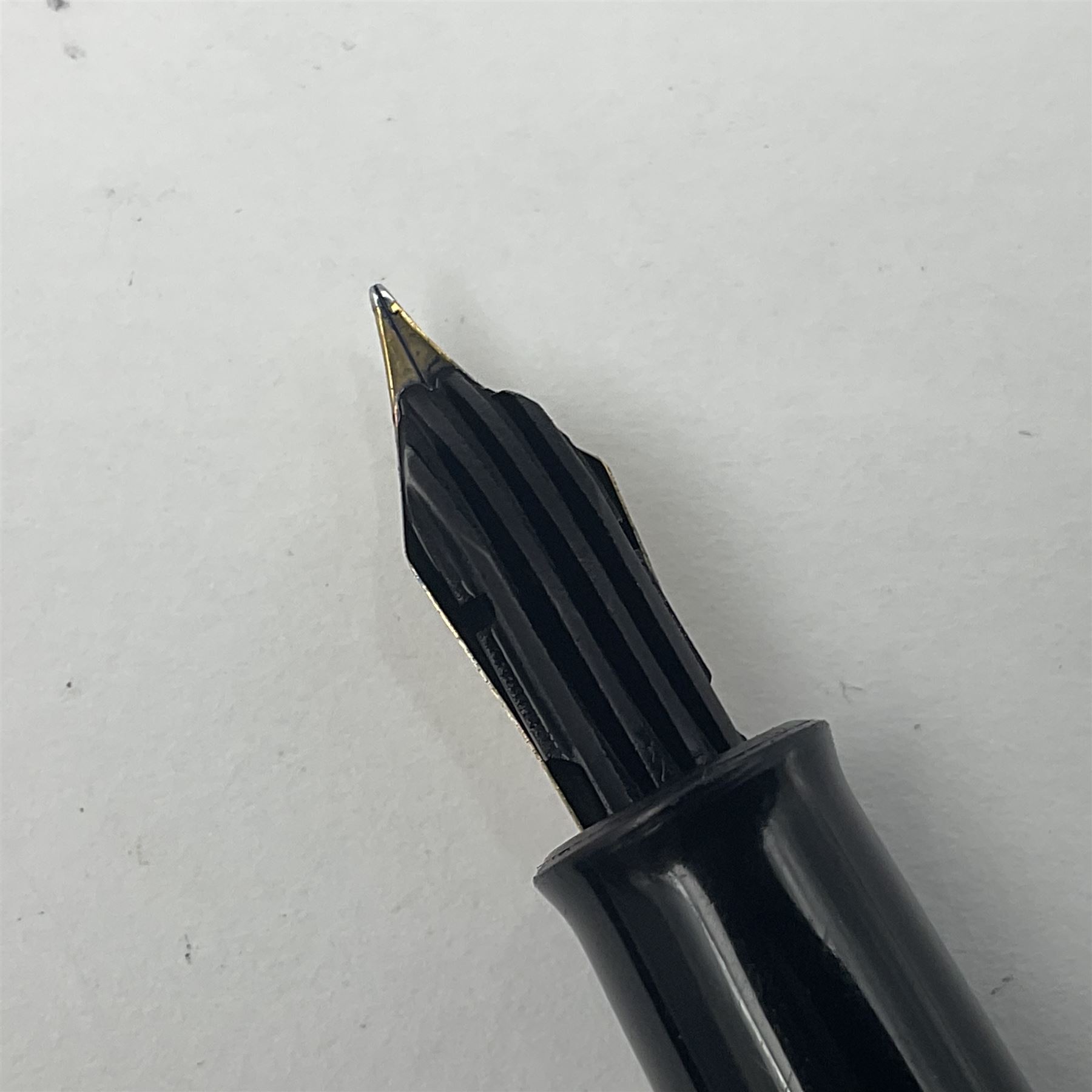 Pelikan Souveran 140 fountain pen, the green and black striped barrel with gold plated beak shaped clip and bands, with gold nib stamped 14C-585, together with matching twist ballpoint pen, push ballpoint pen and propelling pencil, largest approx L13.5cm (4)