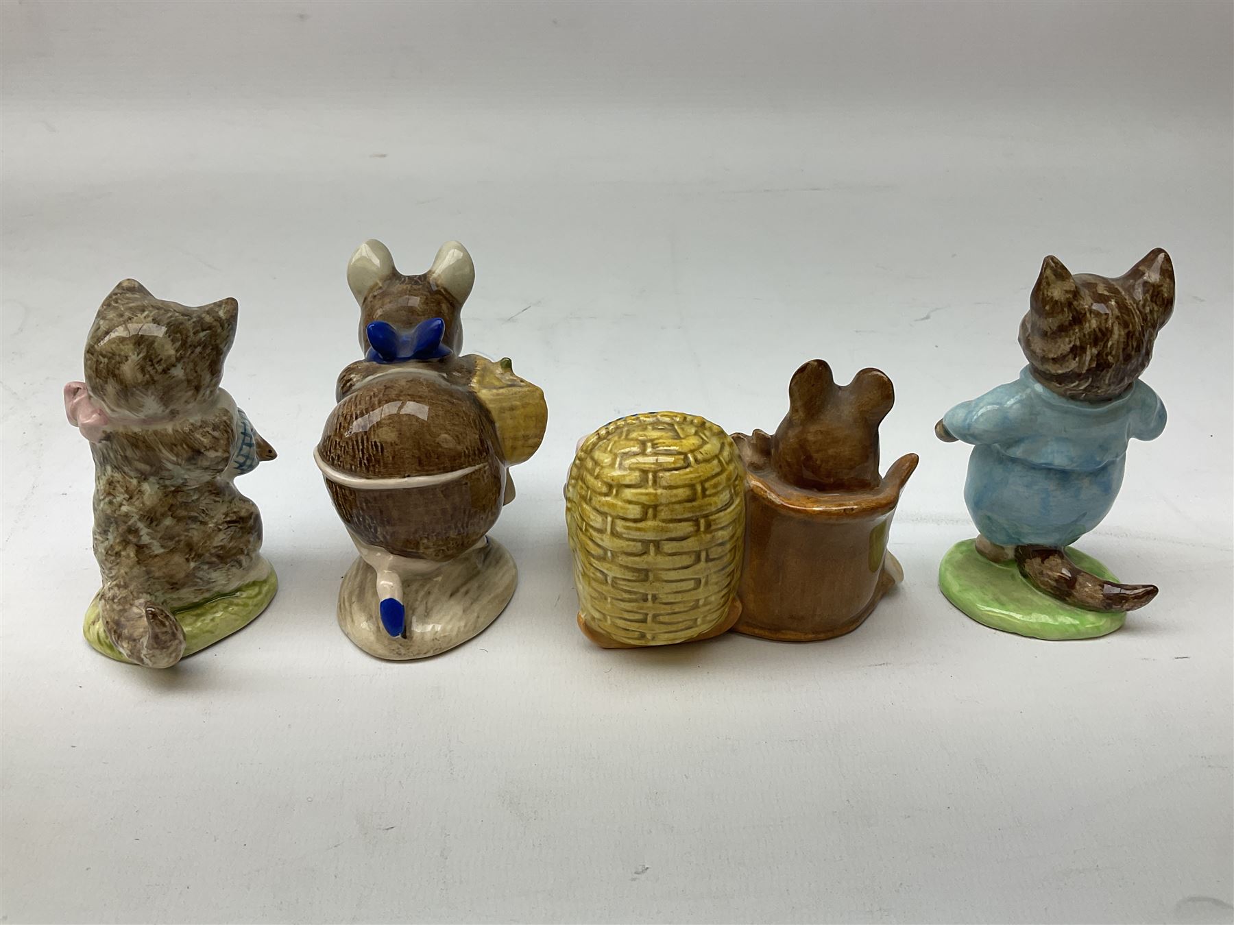 Nine Beswick Beatrix Potter figures, comprising Tabitha Twitchett, Appley Dapply, Tom Kitten Tailor of Gloucester, Ribby, Hunca Munca, Amiable guinea-pig, Miss Moppet and Poorly Peter rabbit,  all with printed mark beneath 