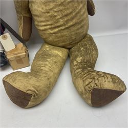 Mid-20th century woodwool filled teddy bear; and porcelain doll dressed as a WW2 evacuee