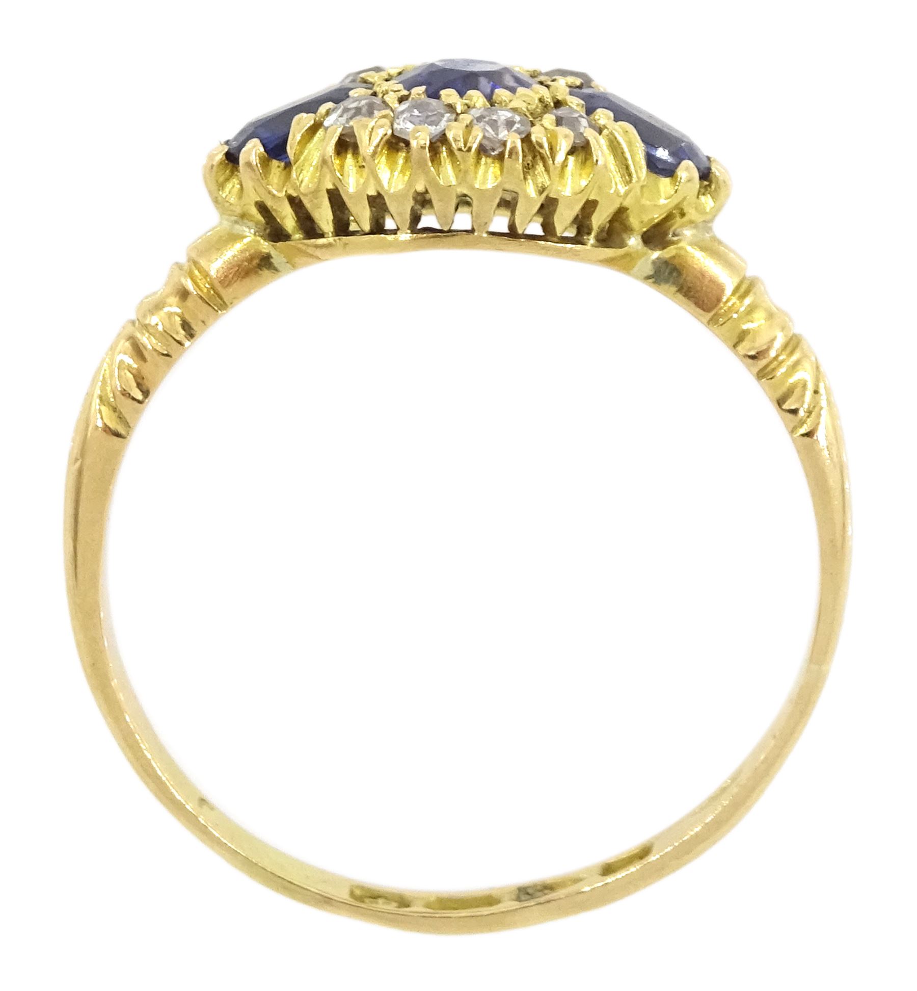 Early 20th century 18ct gold three stone oval cut sapphire and eight stone diamond cluster ring, Chester 1916