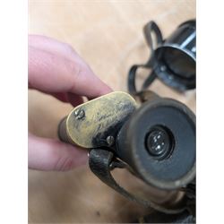 Four pairs of early 20th century binoculars, including Carl Zeiss Jena Feldstecher binoculars, Carl Zeiss Telact 8x binoculars, Dollond x5 field binolculars and one other pair, all in leather cases, one case marked with broad arrow, some with officers name etched