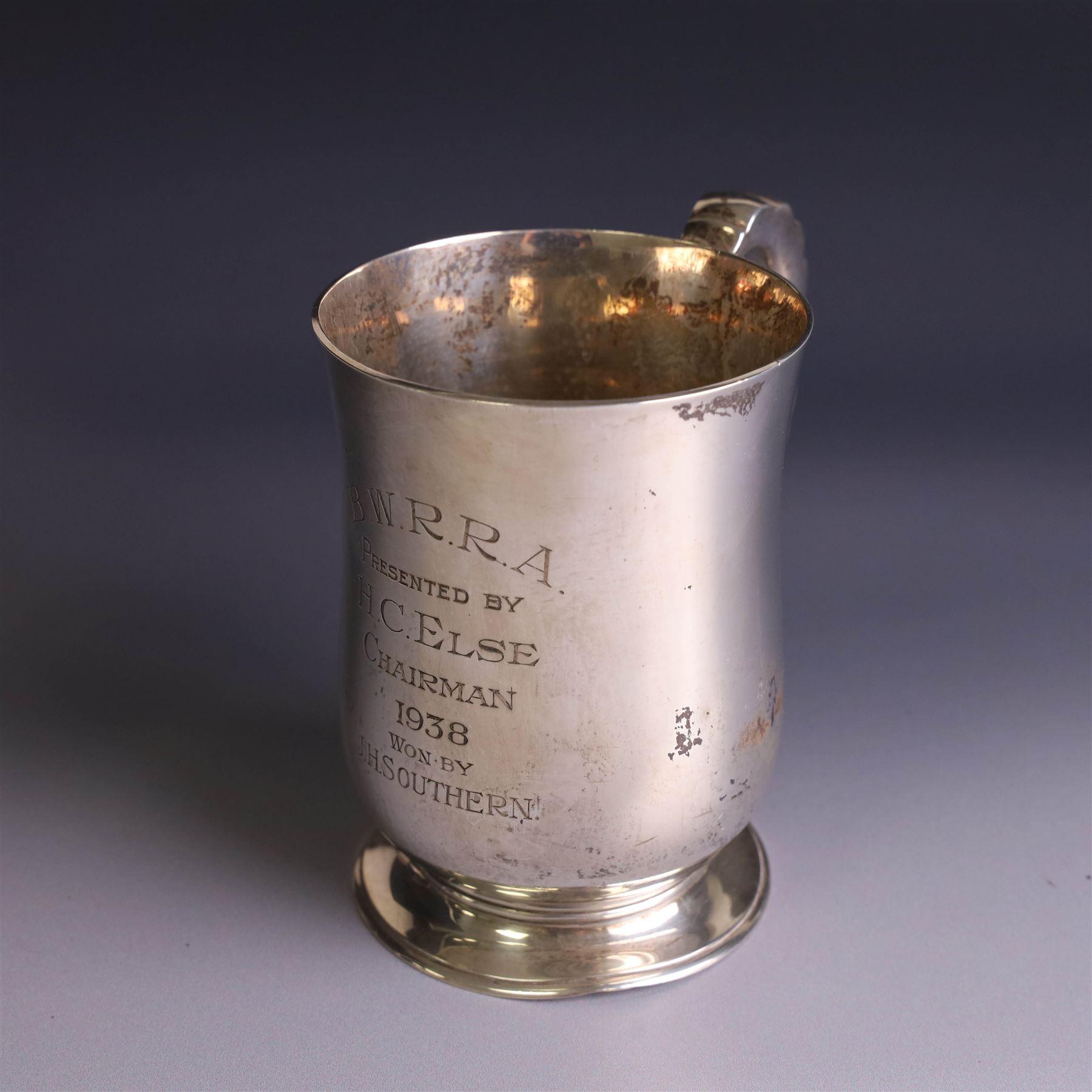 1930s silver tankard, of typical bellied form upon a circular base with ribbed handle, the body with presentation engraving, hallmarked Mappin & Webb Ltd, Sheffield 1937, H12cm