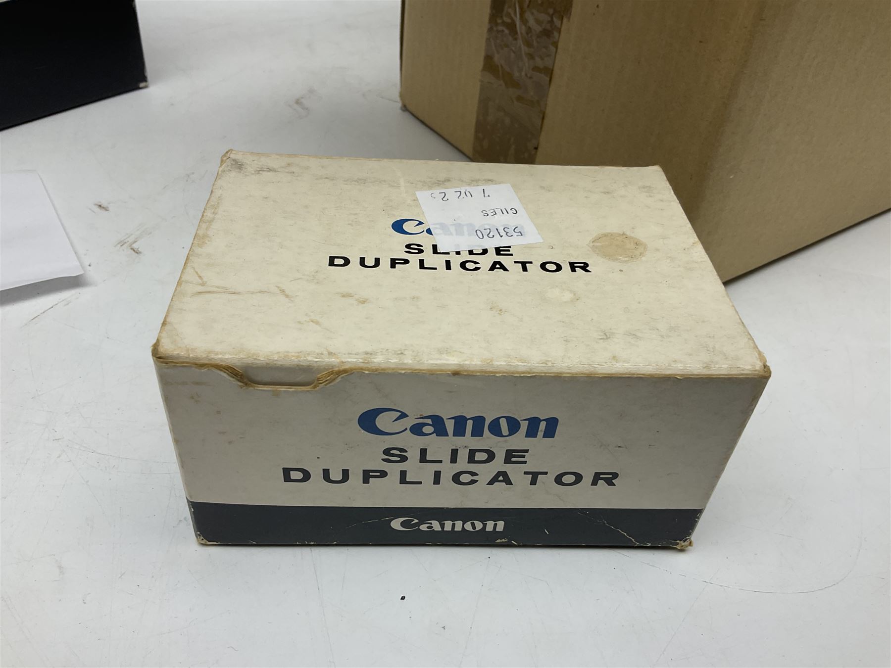 Collection of Canon lenses, to include 'Canon Lens FD 100mm 1:2.8', serial no 12821, 'Canon Lens FD 200mm 1:4' serial no 245313, 'Macro Canon Lens FL 50mm 1:3.5', serial no. 25505, 'Canon Lens FD 135mm 1:3.5 etc, together with other Canon equipment, including Bellows FL, Slide Duplicator etc 
