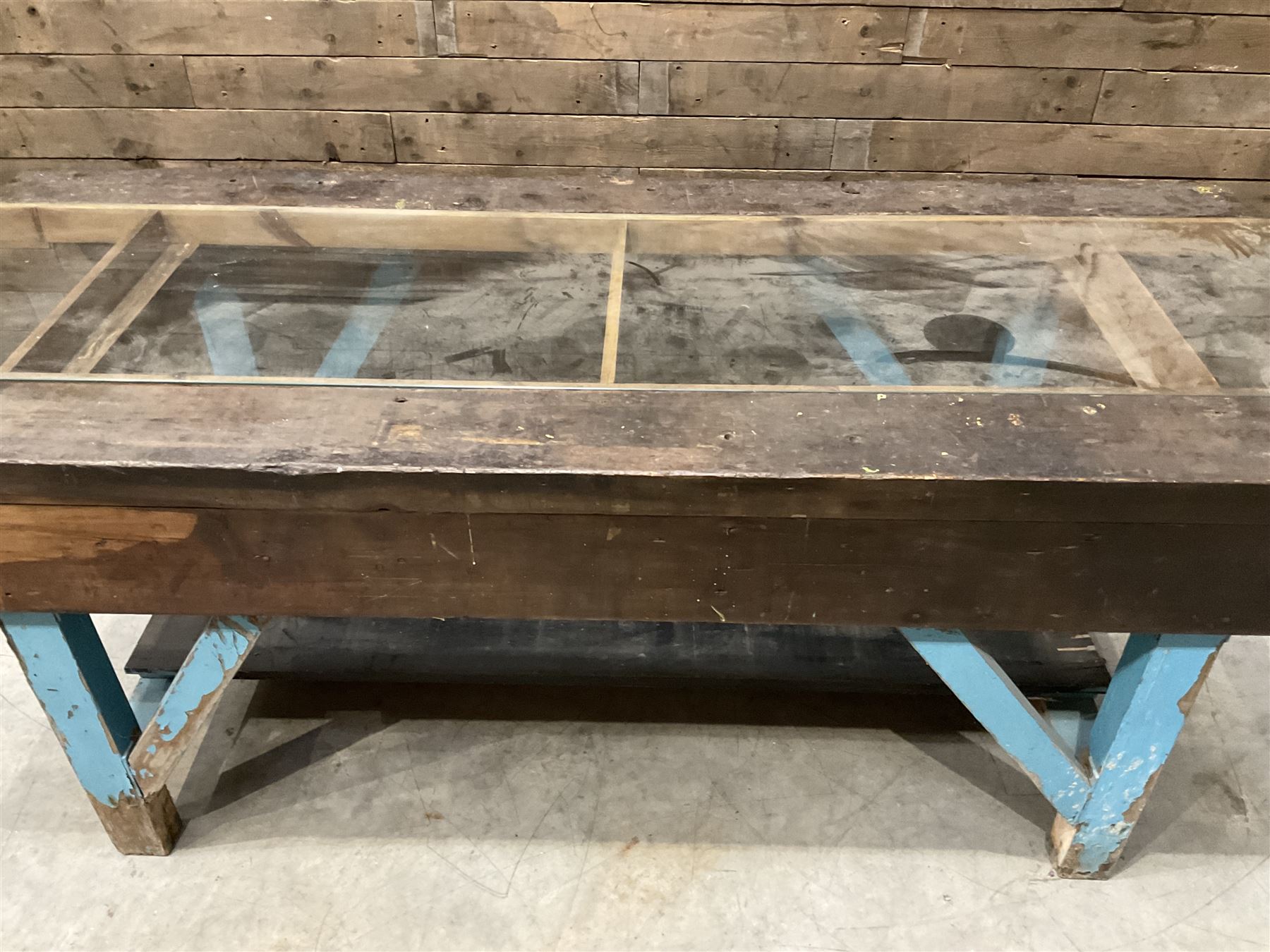 Large timber work bench with central glass section, and two pairs of vintage wooden step ladders (3)