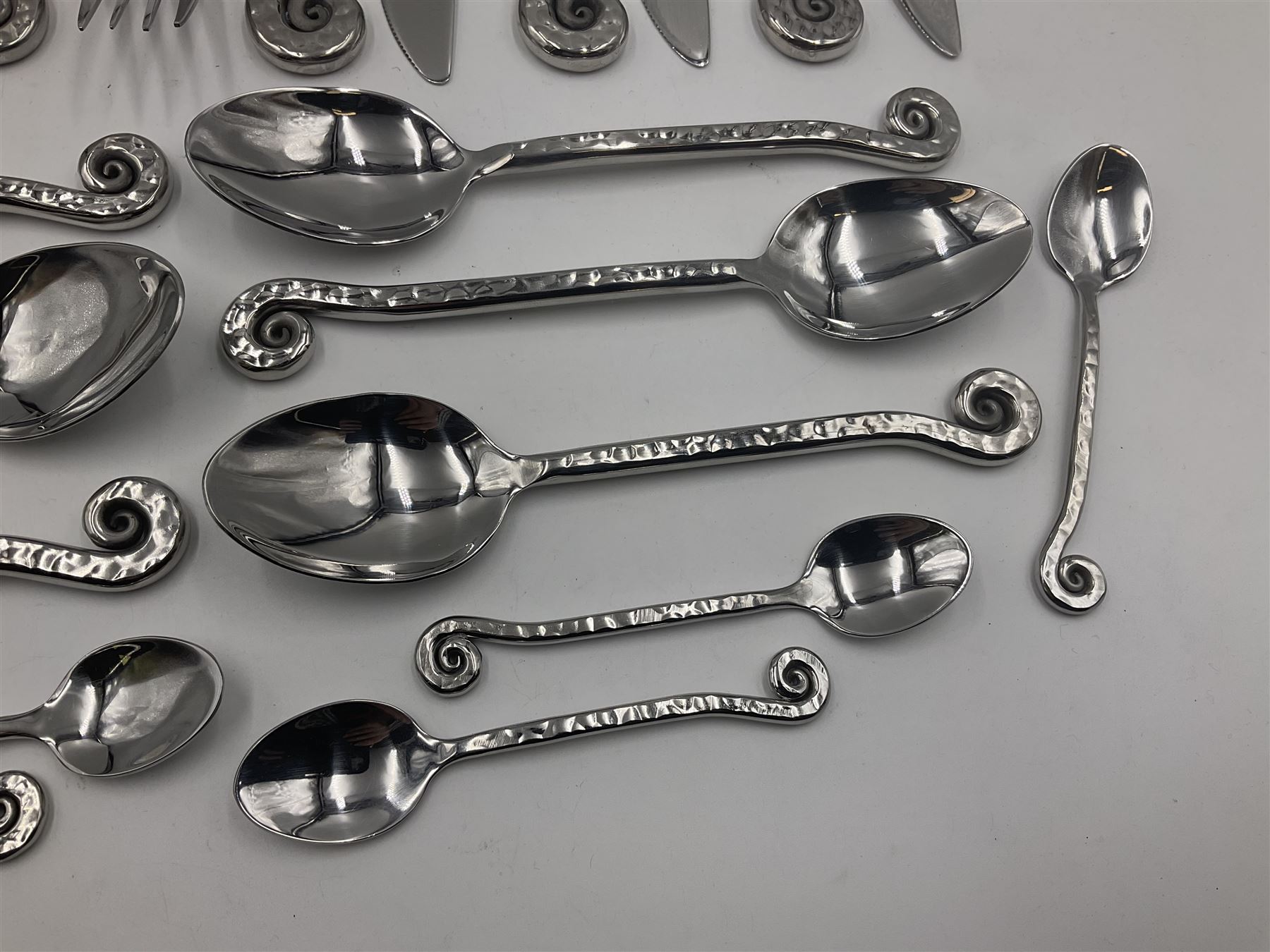 Artisan 24 piece stainless steel cutlery set in the Hammered Shell pattern