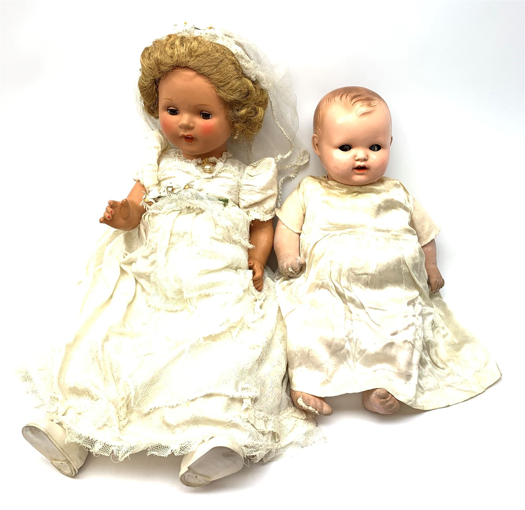 Seyfarth & Reinhardt composition head baby doll with moulded hair, sleeping flirty eyes, open mouth with one tooth and tongue and soft body with composition jointed limbs, marked 'SuR Germany 30/5' H47cm; together with a Golborne Dolls 'Golborne Beauty' composition head and body bride doll, marked 'F.P.23' in original box H63cm (2)