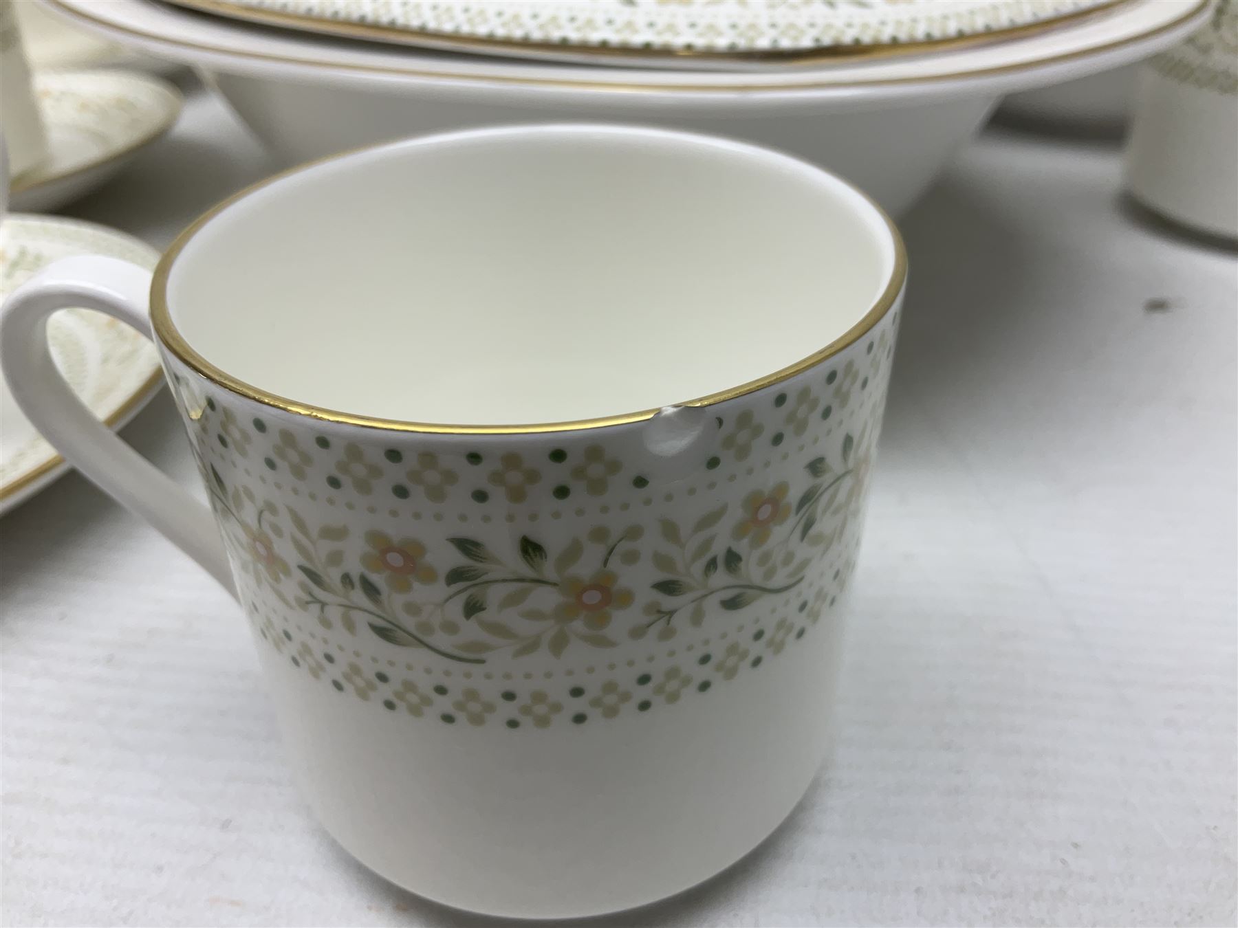 Royal Doulton Paisley pattern tea and dinner service for twelve, comprising dinner plates, side plates, soup bowls, dessert bowls, tea plates, two lidded tureens, sauce boat and saucer, sucrier and jug, oval serving dish and teacups and saucers
