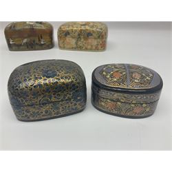 Nine lacquered boxes, all rectangular form, including russian examples decorated with animals within a stylized landscapes and example with flower decoration, largest H7cm, L11cm