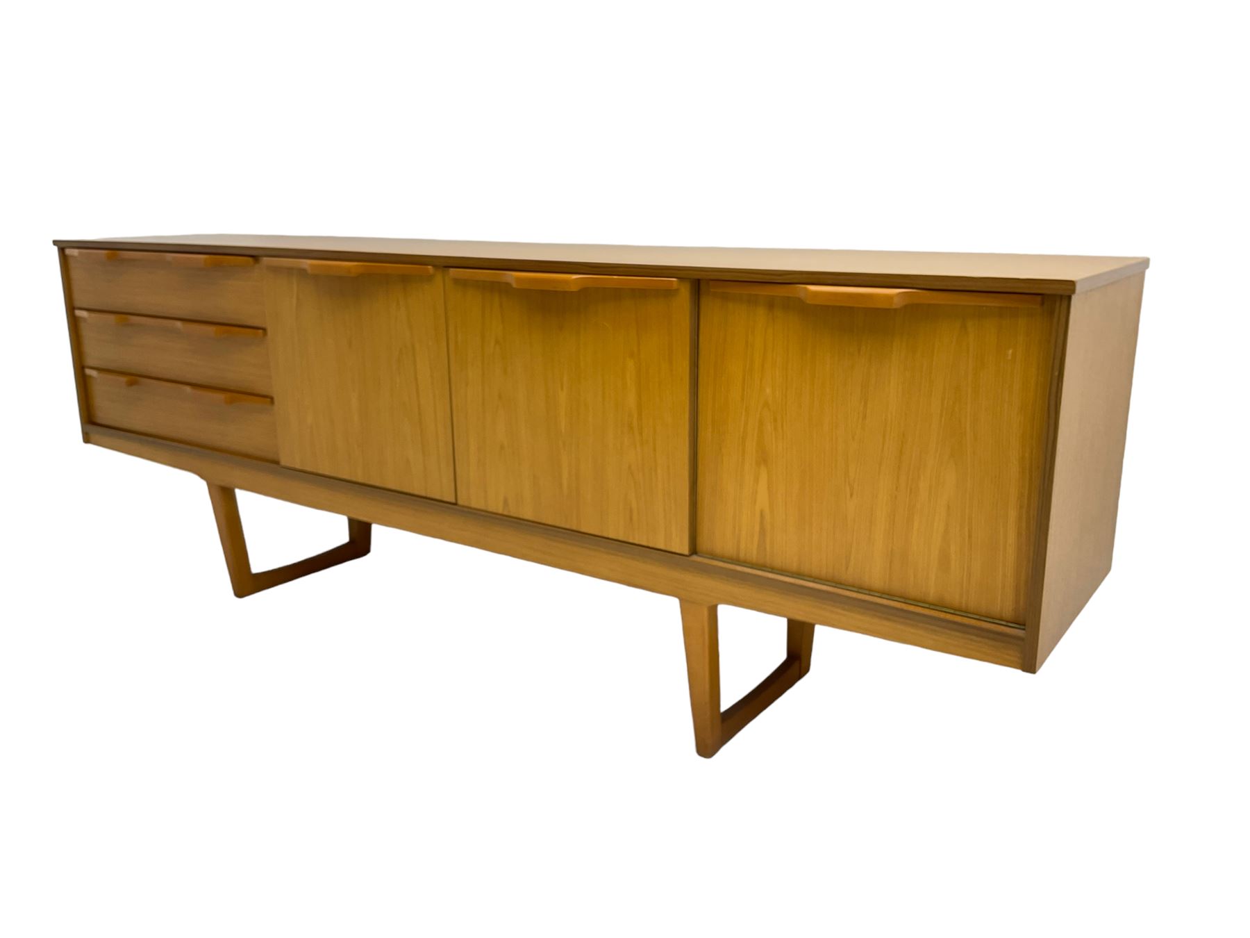 Stonehill Furniture (SF) Ltd - mid-20th century teak sideboard, rectangular topover three drawers, two cupboard doors and fall-front drinks cupboard, raised on square tapering supports