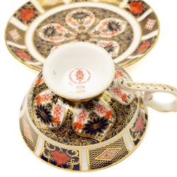 Set of five Royal Crown Derby pattern 1128 teacups and saucers