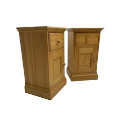 Pair traditional pine bedside cabinets, single drawer over cupboard