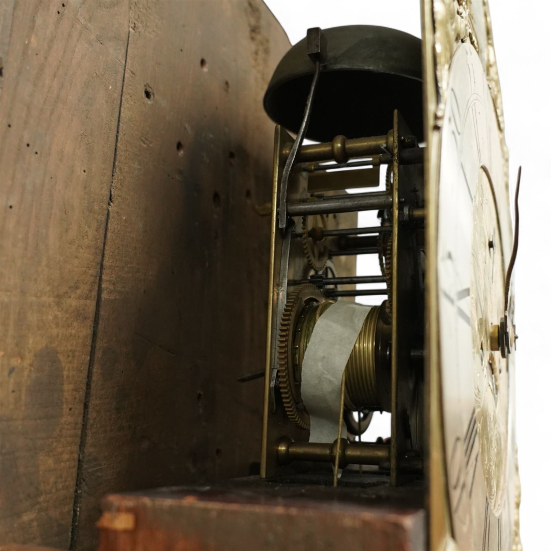 William Vise of Wisbech (Cambridgeshire)-8-day mahogany Longcase clock c1750, with a swan neck pediment and inlaid parterre, break arch hood door beneath flanked by detached reeded pilasters with brass capitals, trunk with conforming pilasters to the corners and an inlaid door with banding to the edge and oval satinwood inlay and matching conche inlay to the centre, conforming pediment with matching circular inlay and raised on bracket feet, brass break arch dial with interesting scroll and floral spandrels to the arch and four season spandrels to the corners, fully engraved dial centre with steel hands, engraved seconds dial and square date aperture, silvered boss to the arch with makers name and conforming chapter with Roman numerals, five minute Arabic's and minute track, dial pinned directly to a two train weight driven rack striking movement, sounding the hours on a bell. With weights and pendulum. 
Both a William and John Vise are recorded as working in Wisbech between 1740 and1758.