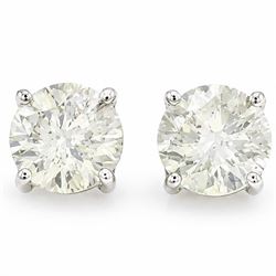 Pair of 18ct gold diamond earrings, each stud four claw set with a round brilliant cut dia...