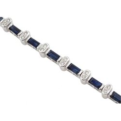 18ct white gold sapphire and diamond bracelet, twenty-two baguette cut sapphires, each separated by two round brilliant cut diamonds, hallmarked