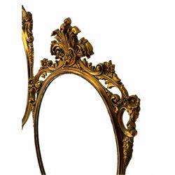 Pair oval gilt wall mirrors, the frames decorated with foliate scrolls and flower heads 