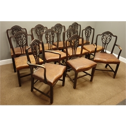  Set eleven (9+2) George III mahogany dining chairs, shaped cresting rail carved with husks and flower heads, scrolled fret work splat backs, serpentine drop in seats upholstered in leather moulded supports with chamfered inner,   