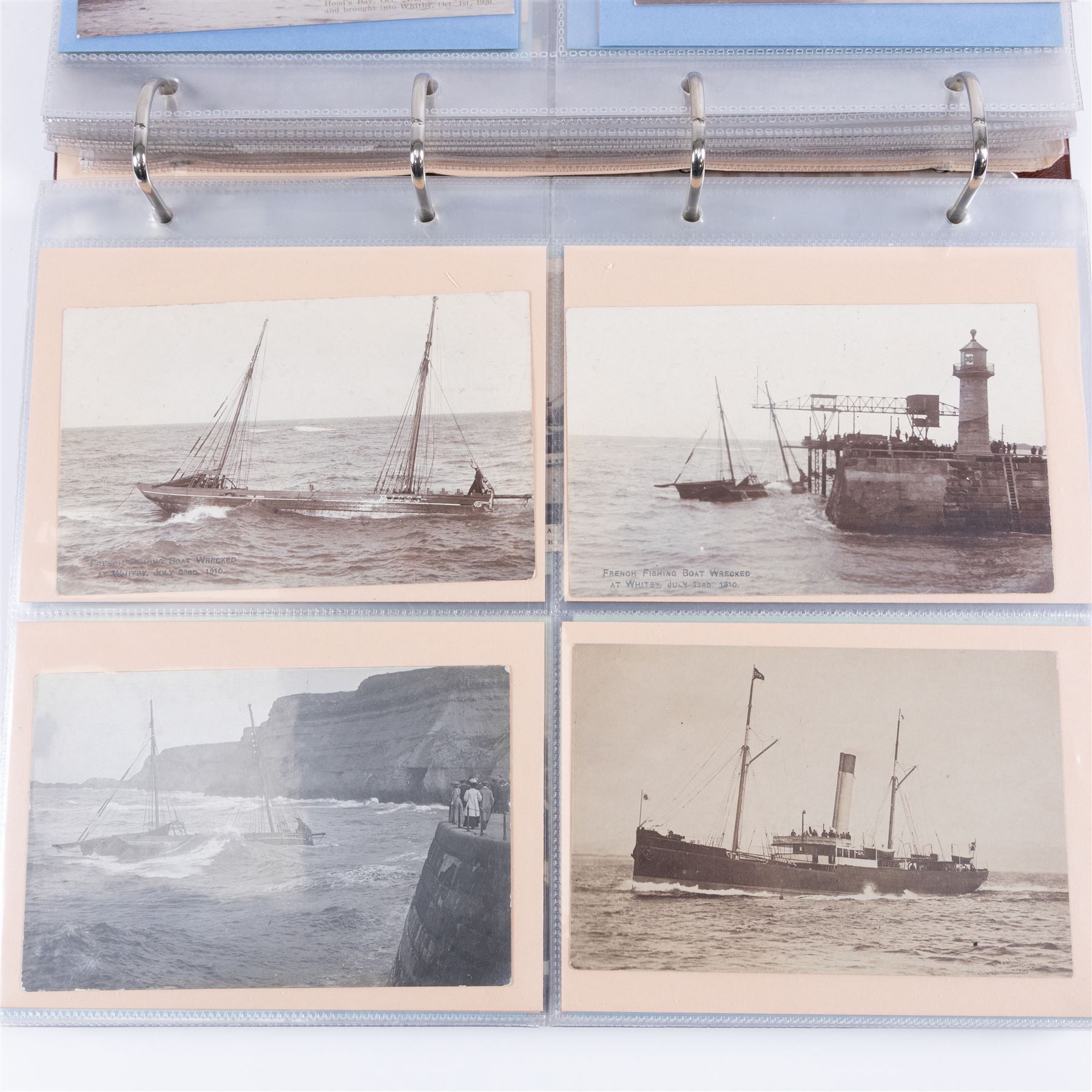Two-hundred and thirty eight early 19th century to 20th century Whitby view postcards, including twenty-four early 19th century court cards, seventeen views of Whitby Abbey, forty depicting the fishing fleet and harbour, with a selection of cards providing a detailed study of the early 'Yards' the fisherman's dwellings around the harbour, all housed within a Stanley Gibbons Picture Postcard Album