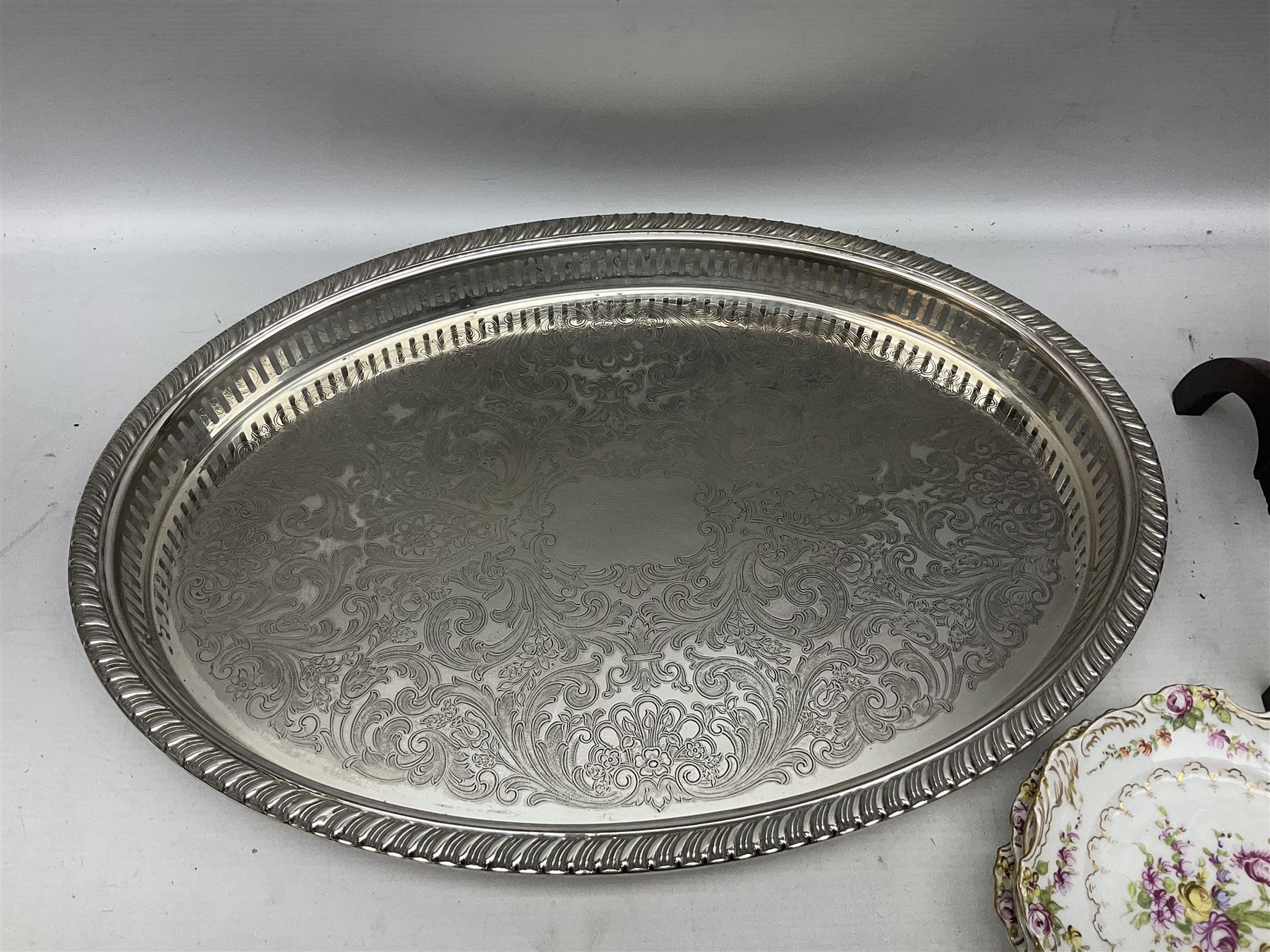Set of four Dresden dessert plates hand painted with flowers and gilt scrolls, together with silver plate serving dish, a mahogany folding cake stand and a collection of coins