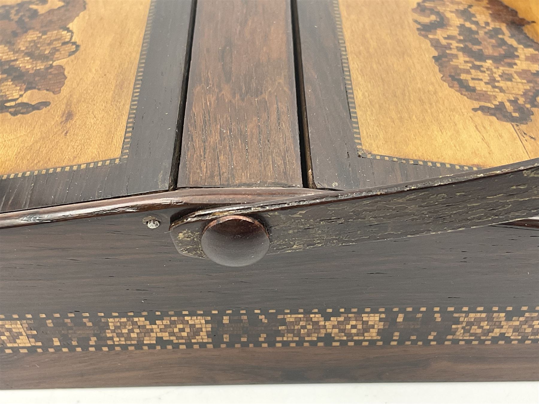 19th century rosewood Tunbridge Ware basket, of rectangular form with curved bentwood handle, and twin hinged sloping covers, lifting to reveal paper lined interiors, not including handle H5.5cm D10.5cm L18cm