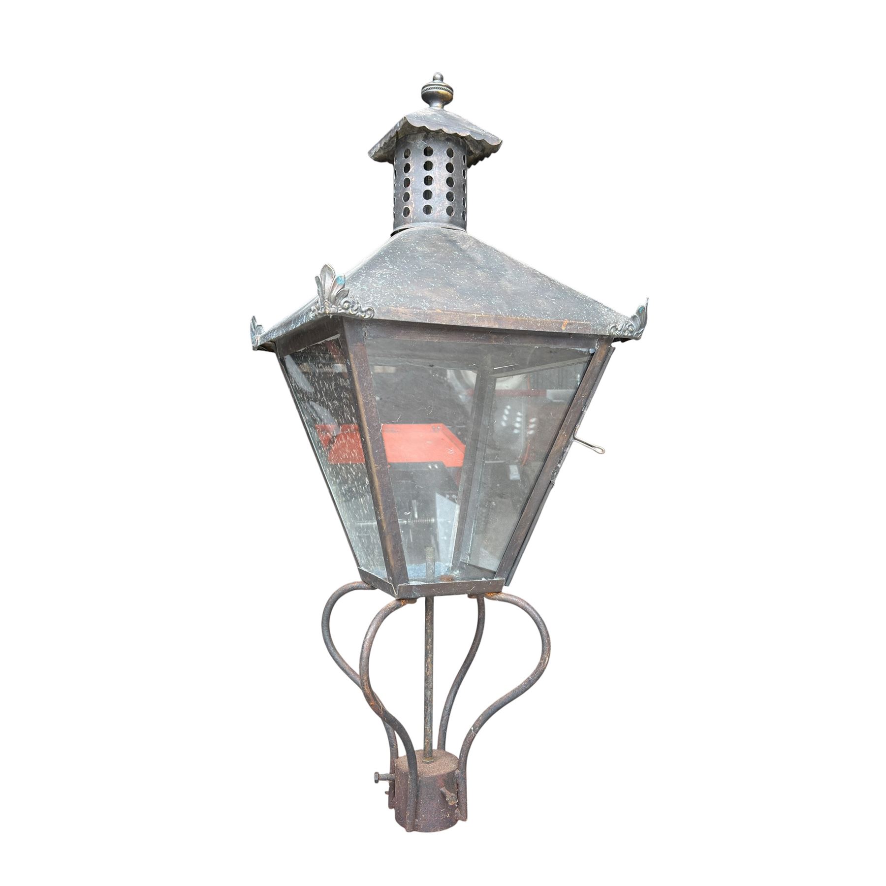 Early 20th century brass and cast iron garden lantern or street light, turned finial over four panel glazed body, cast iron base