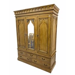 Gothic polished pine triple wardrobe, fitted with five drawers 