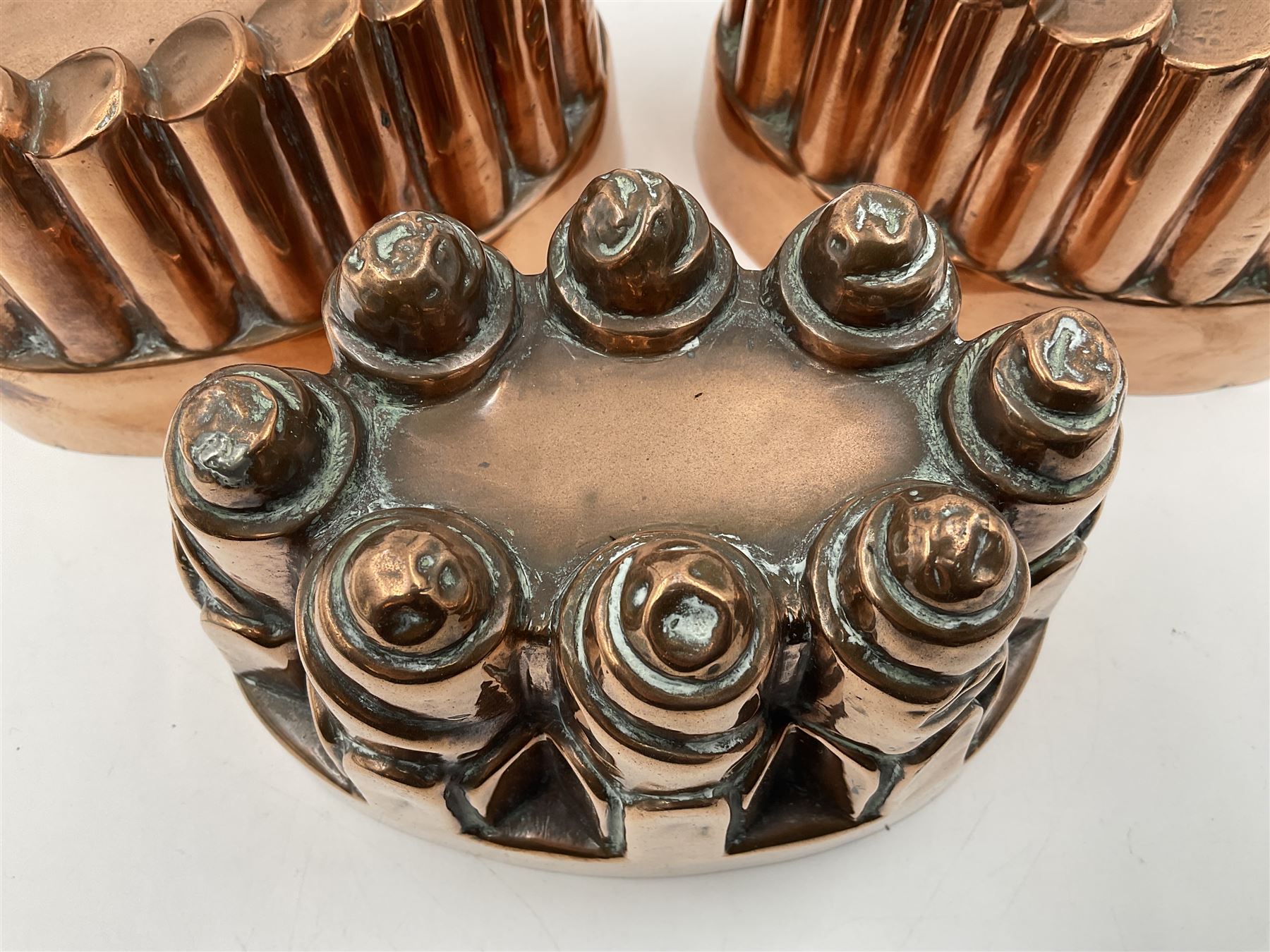 Five Victorian copper jelly mould, largest H10cm, L16cm