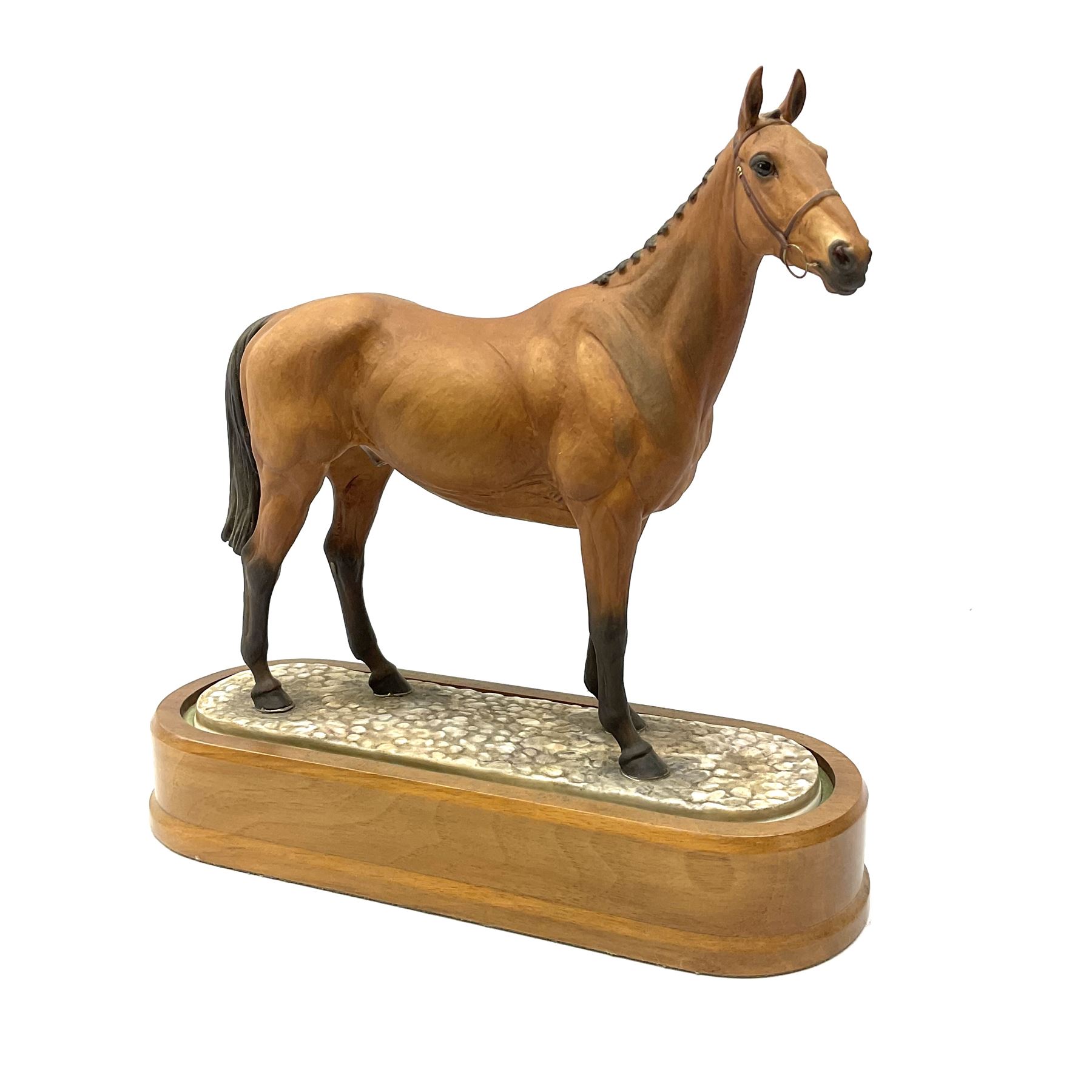 A Royal Worcester limited edition figure, Arkle, owned by the Duchess of Westminster, modelled by Doris Lindner, on wooden base, H27cm. 
