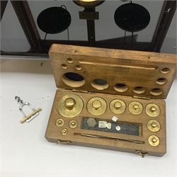 Brass laboratory scales by Stanton Instruments Ltd. Model No. C.B.3, in glazed mahogany cabinet with upward sliding front, two hinged side doors and black vitrolite type base W41cm H45cm; with wooden cased set of brass weights