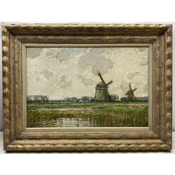 Kershaw Schofield (British 1872-1941): Dutch Landscape with Windmills beyond a Reedy Pond, oil on panel signed 34cm x 51cm