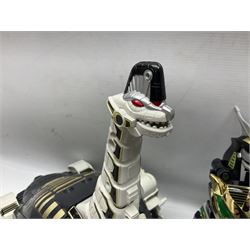 Collection of early 90s Mighty Morphin’ Power Rangers Zords, figures and accessories. Titanus the Carrier Zord, marked Bandai 1991; Green Dragonzord, incomplete; 1994 White Tigerzord with original instruction manual; 1993 Triceratops Dinozord, Mastodon Dinozord and Sabertooth Tiger Dinozord, Pterodactyl Dinozord, missing guns; with 1993 Power Morpher and original Power Coins, with further related figures, accessories and weapons