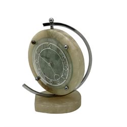 English 1920's Art Deco white-onyx mantel clock c1920, with a circular marble surround,  glass fronted chrome plated chapter with fretted Arabic numerals and conforming hands, movement and dial suspended in a semi-circular swivel gimbal mount, spring driven movement with a balance escapement, wound and set from the rear.