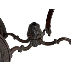 19th century Irish rosewood centre table, the shaped and moulded top over shaped apron carved with scrolled foliage, on serpentine supports carved with bell flowers, the supports united by anthemion carved finial and s-scroll x-framed stretchers