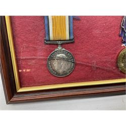 WW1 pair of medals comprising British War Medal and Victory Medal awarded to 104830 Pte. A. Gosling Durh. L. I. with ribbons; mounted and glazed in a mahogany stained frame with two photographs of Gosling in civilian dress, one wearing a War Service badge