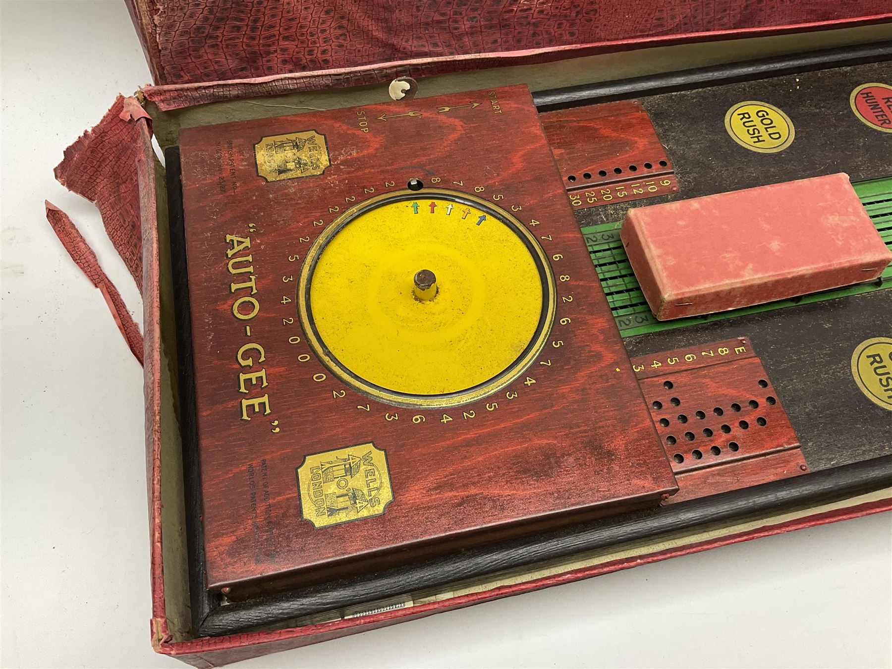 'Auto Gee' painted metal and stained wood horse racing game by Wells, London,  with some markers and horse, length 87cm