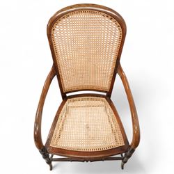 Victorian stained beech frame open armchair, arched cane work back and seat, on turned supports with splayed feet united by turned stretchers 