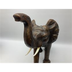 Liberty style dark leather clad model of an elephant, its trunk raised and in standing pose, together with a leather clad model of a horse with cut leather ears, largest example 