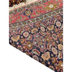 Persian Bijar red and blue ground rug, central panel decorated with tree of life and flower head motifs, decorated all-over with Herati motifs, triple band band border decorated with stylised plant motifs