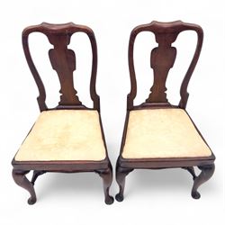 Pair of early 18th century walnut side chairs, vase-shaped splats beneath shaped top rails, drop-in seats upholstered in floral damask, on cabriole front legs terminating in pad feet, united by turned stretchers