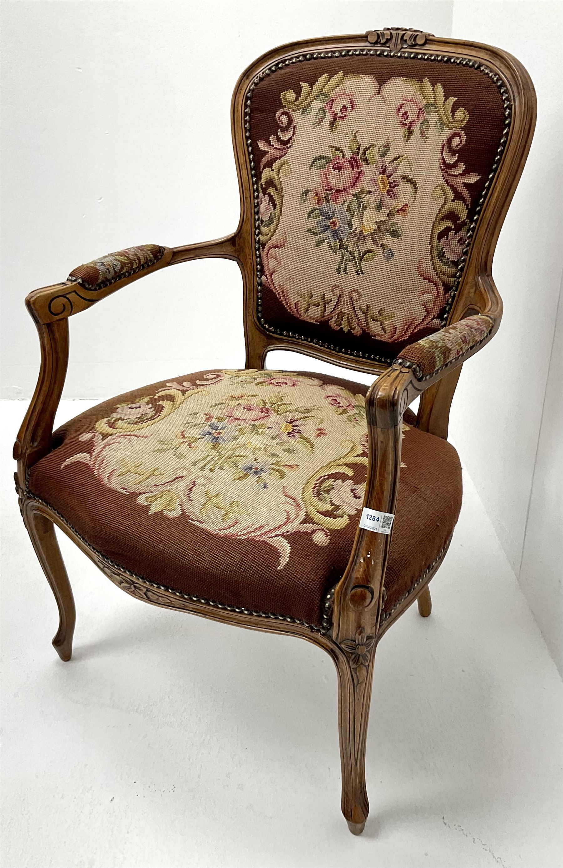 French walnut framed chair, scrolling arms, upholstered floral fabric, cabriole legs 